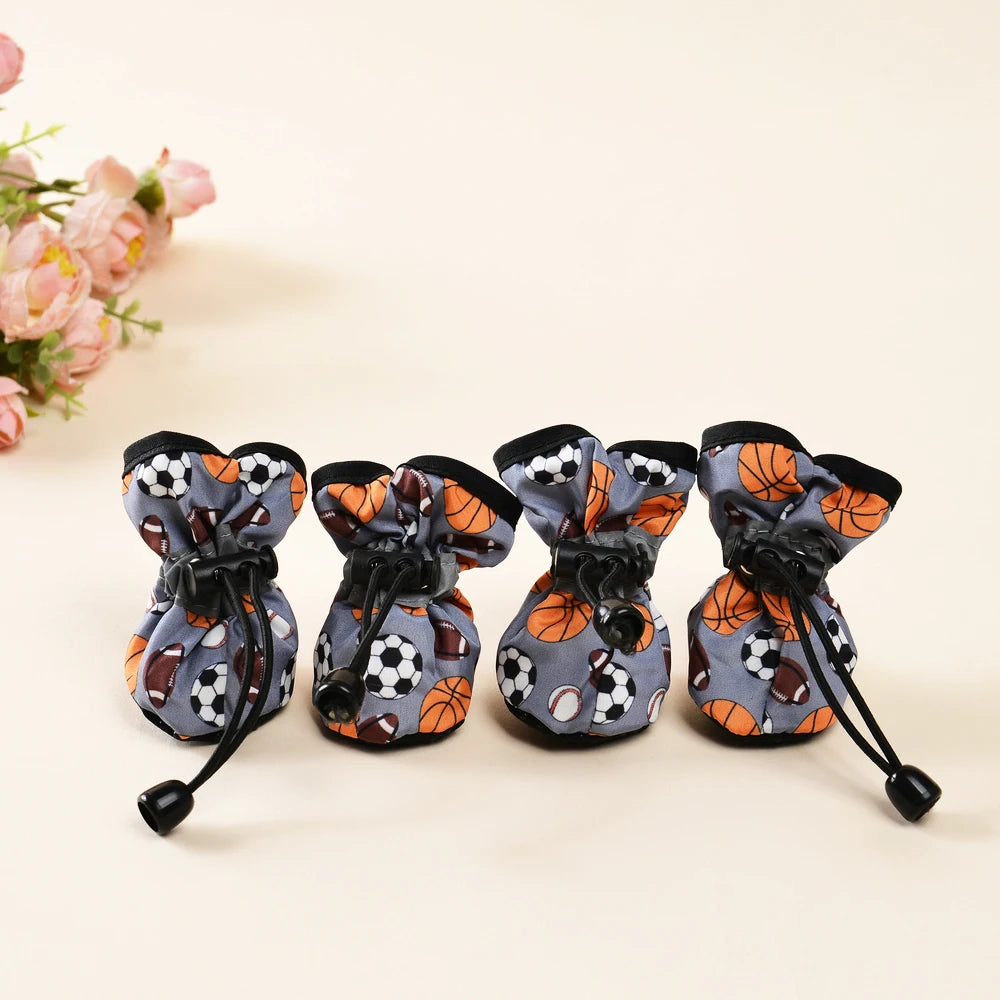 Bottes pour chiens de couleur gris et noir avec des formes de ballons. Les bottes sont ajustable facilement. Image produit Boutiquechien