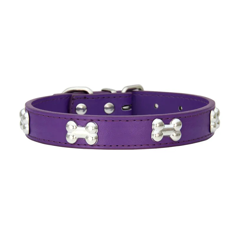 Collier style cuir de couleur violet pour chiot. Le collier possède des médaillons en forme d'os. Image produit Boutiquechien