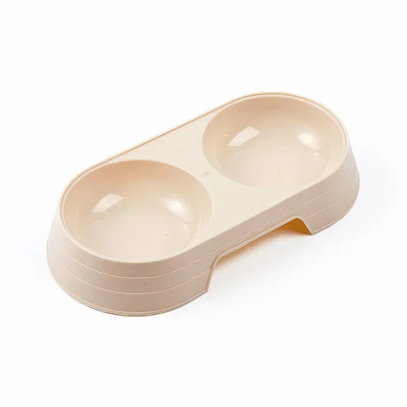 Gamelle en plastique pour chiot de couleur pêche. Petit gamelle double de couleur bleu pour les chiots. Image produit Boutiquechien