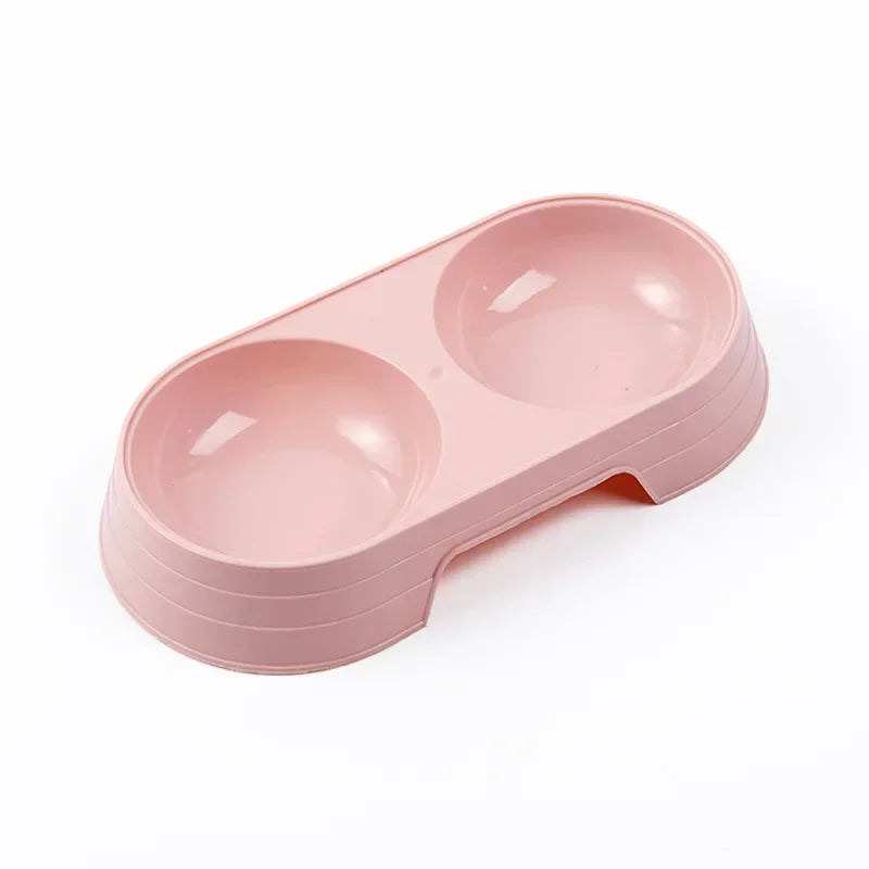 Gamelle en plastique pour chiot de couleur rose. Petit gamelle double de couleur rose pour les chiots. Image produit Boutiquechien