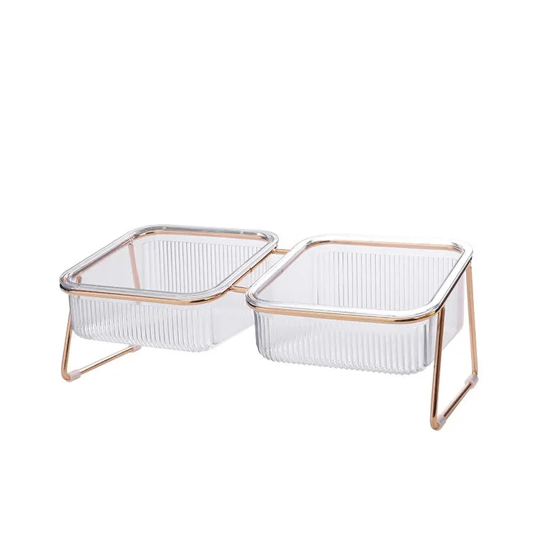 Gamelle double pour chien avec gamelle transparente sur trépied or. Image produit Boutiquechien