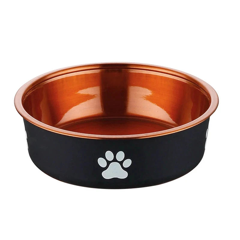 Gamelle pour chien noir anti dérapante et bronze. La gamelle pour chien est anti-dérapante avec une patte blanche dessus. Image produit de boutiquechien
