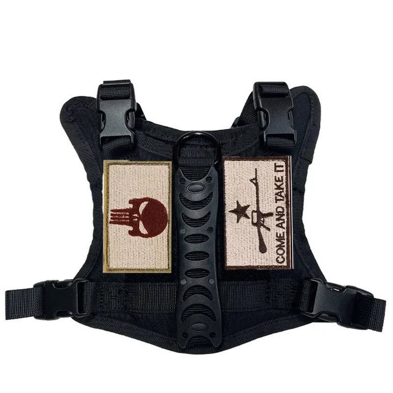 Harnais pour chiot de couleur noir avec écusson avec de grande poignée de traction pour les petits chiots. Image produit Boutiquechien