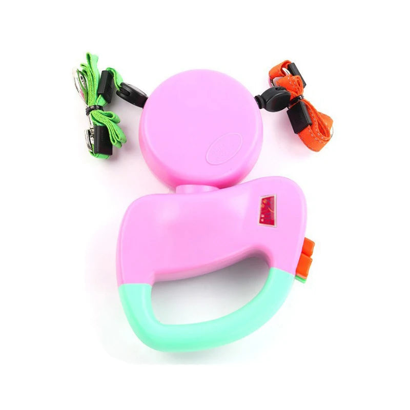 Laisse double pour chien de couleur rose et verte pour chien enrouleur automatique. Image produit Boutiquechien