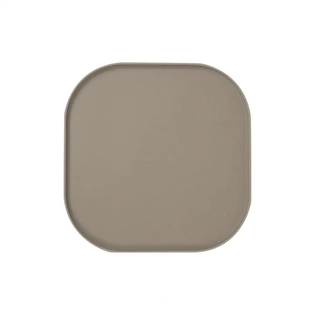 Tapis de protection gamelle de couleur marron en silicone résistant dans un fond blanc. Image produit Boutiquechien