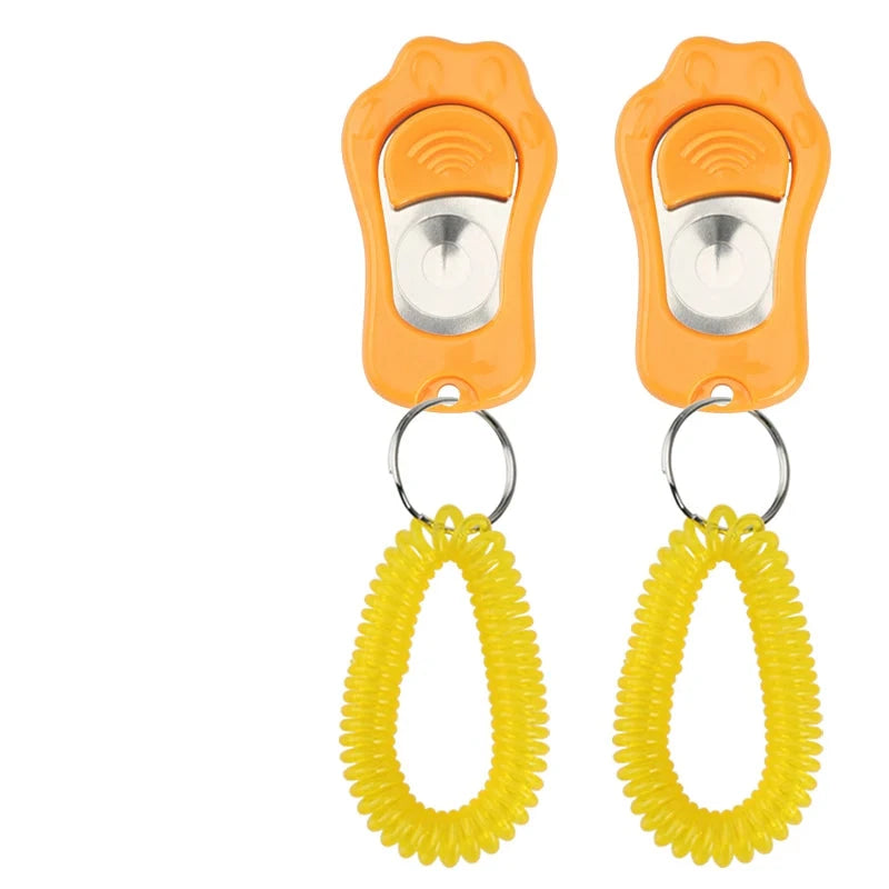 Clicker pour chien rouge avec maintien orange pour les chiens. Image produit Boutiquechien