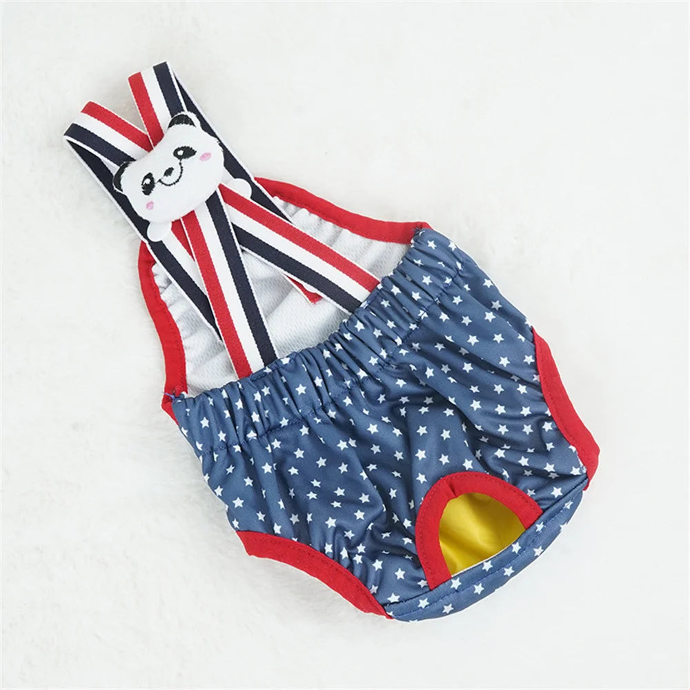 Couche à bretelle pour chien de couleur bleu et blanc avec des formes d'étoile. Le produit est posé dans un fond blanc. Image produit Boutiquechien