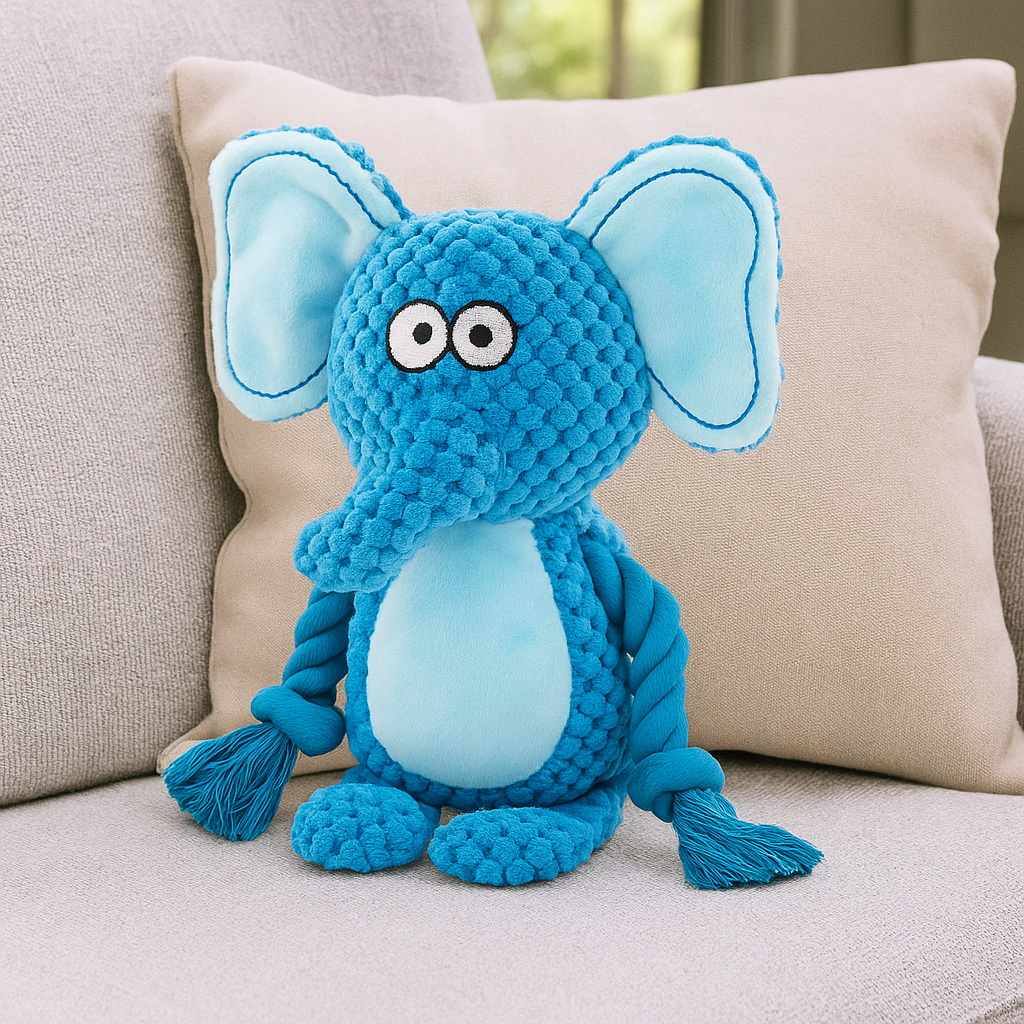 Éléphant Bleu posé sur un canapé de couleur gris. Image produit Boutiquechien