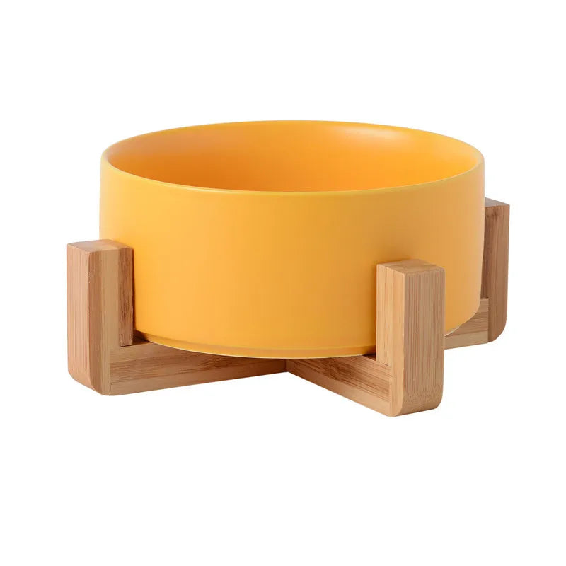 Gamelle en céramique orange pour chien avec support en bois. Image produit Boutiquechien