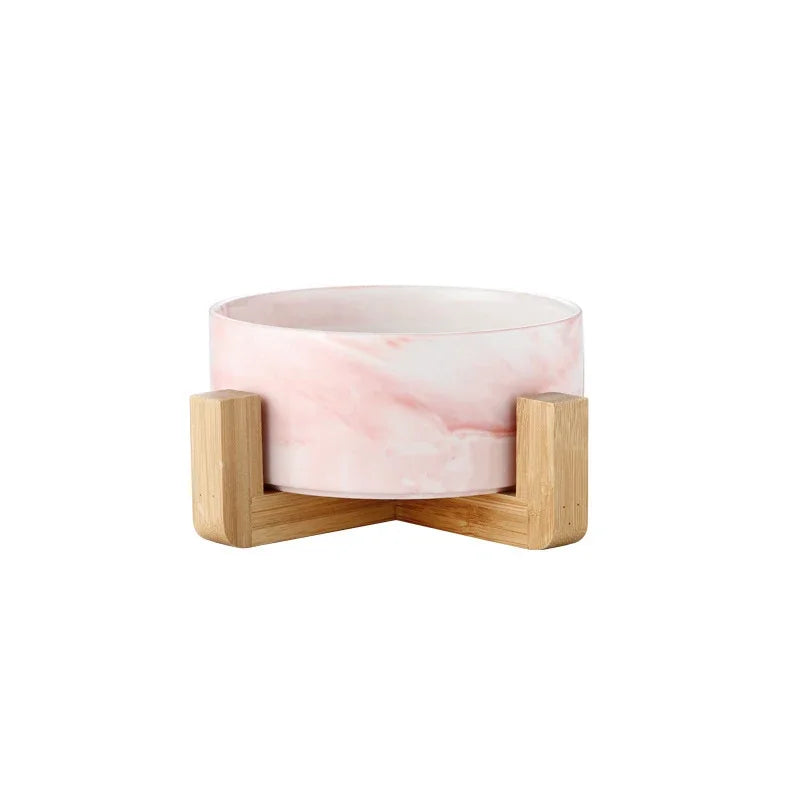 gamelle chien de couleur rose sur un support en bois. Image produit Boutiquechien