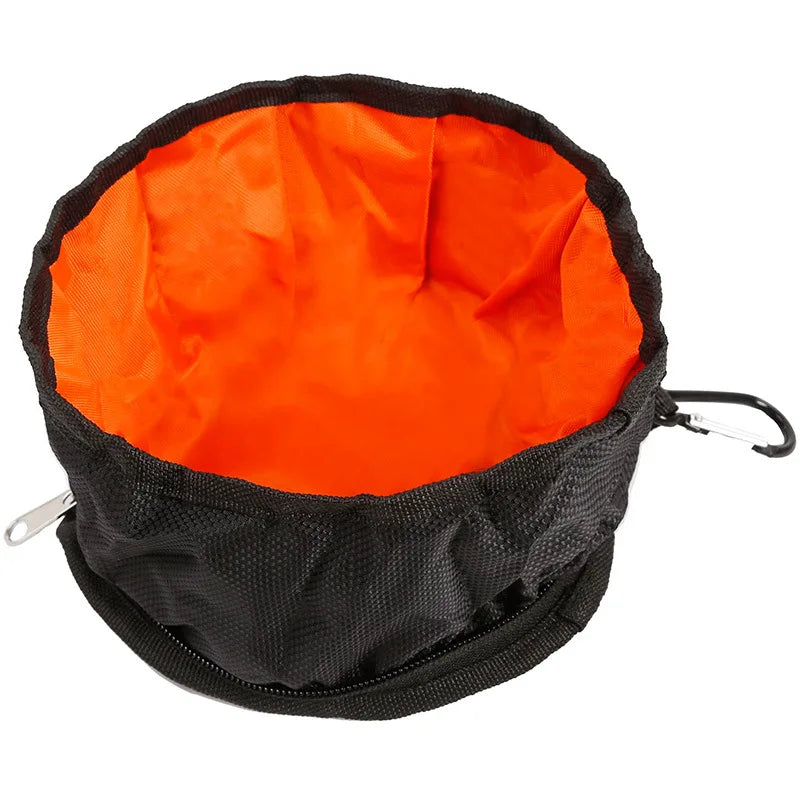 gamelle pour chien pliable de couleur noir et orange avec un mousqueton. Image produit Boutiquechien