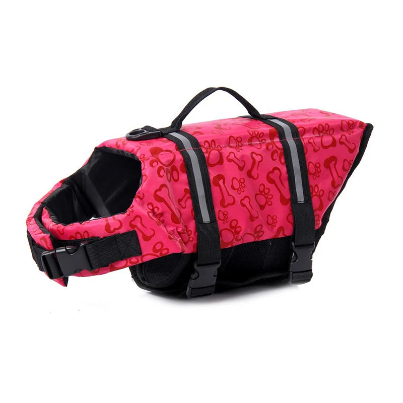 harnais de sauvetage pour chien rouge avec motif d'os et pattes . Sur un harnais il y a une poignée de couleur noir avec des sangles noir. Image produit Boutiquechien