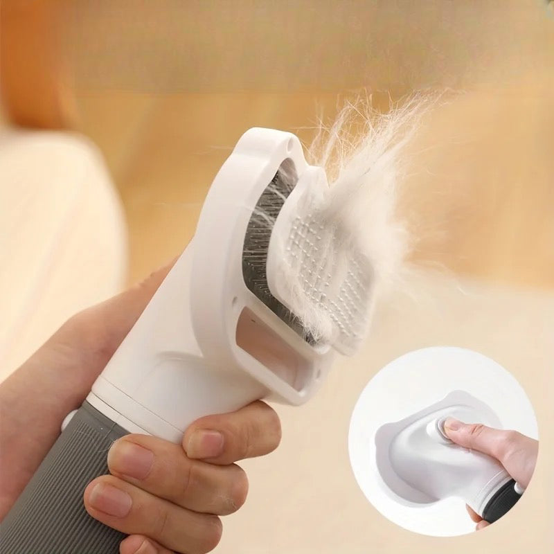 Image du pulseur pour chien qui aspire les poils du chien et les relâche en appuyant sur un bouton. Image produit Boutiquechien