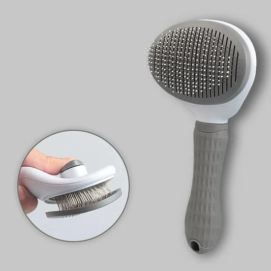 Brosse pour chien de couleur gris et blanc avec un poussoir poil de boutiquechien