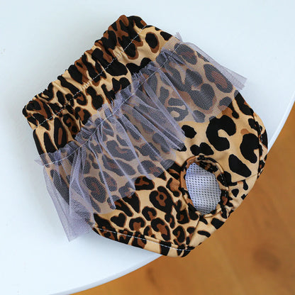 Couche pour chien leopard pour chien sur une table blanche. Image produit Boutiquechien