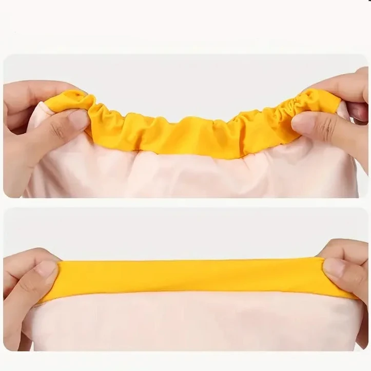 Extension de l'imper pour chien de couleur rose et jaune avec des mains le tenant. Image produit Boutiquechien