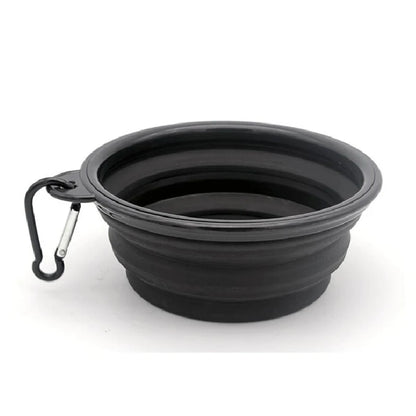 Gamelle pour chien de couleur noir pliante transportable facilement dans un fond blanc. Image produit Boutiquechien