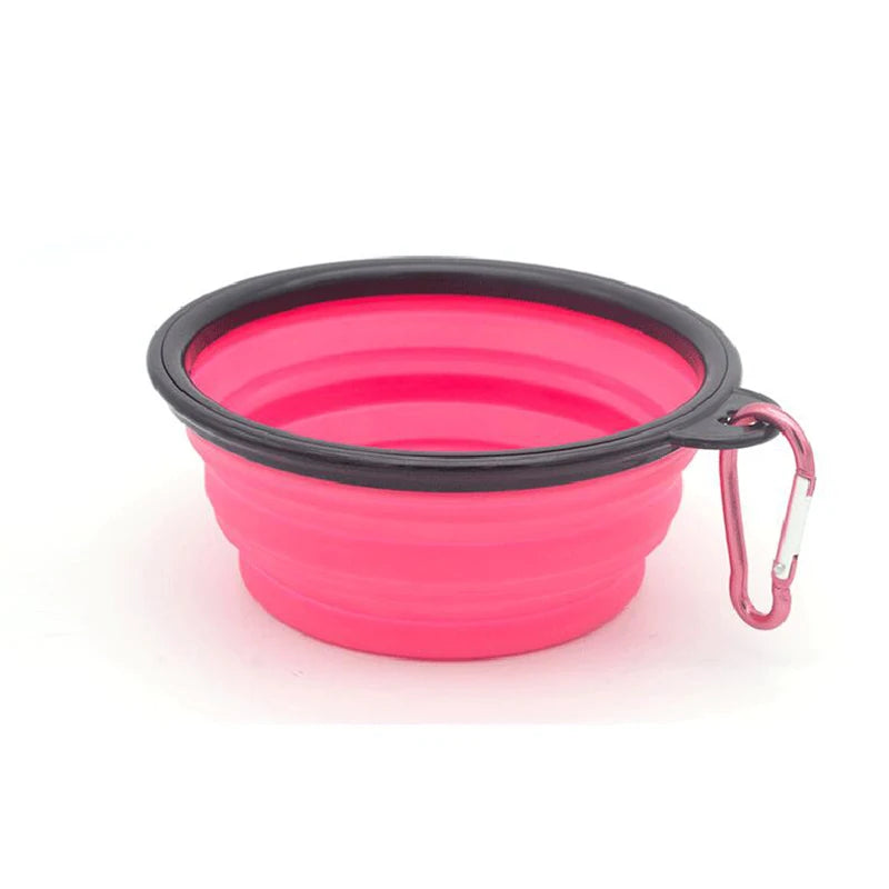 Gamelle pour chien de couleur rose pliante transportable facilement dans un fond blanc. Image produit Boutiquechien