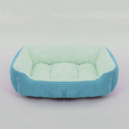Grand panier pour chien XXL vert et bleu rembourré pour un moelleux de qualité supérieur. Panier style velour classe pour grand chien. image produit boutiquechien