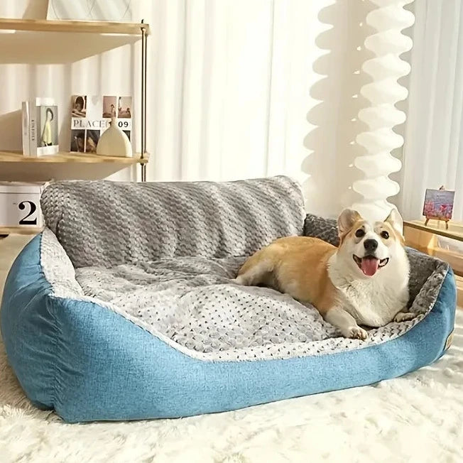Grand panier pour chien déhoussable bleu canard avec un chien dedans de couleur claire  Image