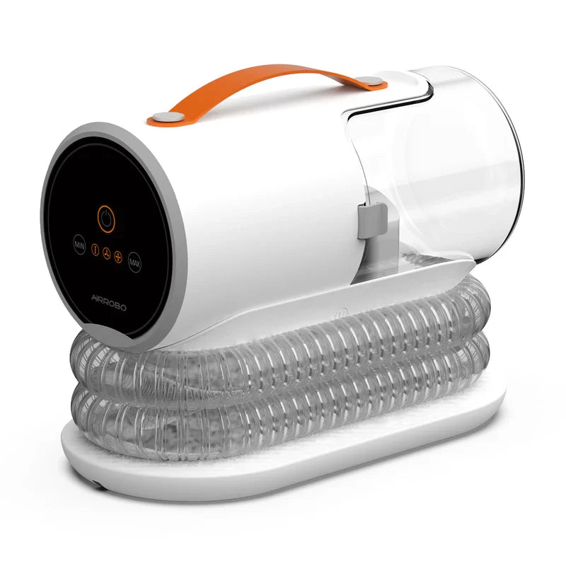 pulseur pour chien silencieux de couleurs blanc avec une poignée orange pour faciliter le transport. Le pulseur est très design avec un tube transparent qui mène au stockage des poils. image produit boutiquechien 