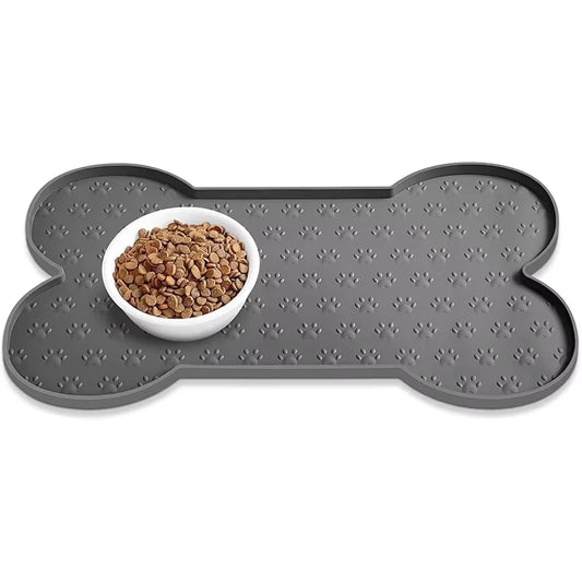 Tapis de gamelle chien humour de couleur noir en forme d'os avec un bol de croquette