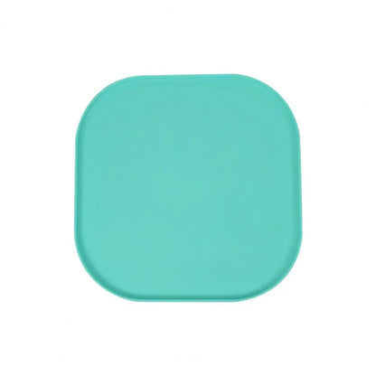Tapis de protection gamelle de couleur vert en silicone résistant dans un fond blanc. Image produit Boutiquechien