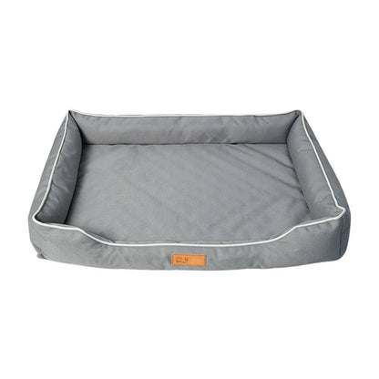 tapis gris pour Gand chien avec rembourrage. Le tapis sert pour les grands chien rembourré. Il y a un logo chinois sur le panier pour chien résistant. Image produit boutiquechien
