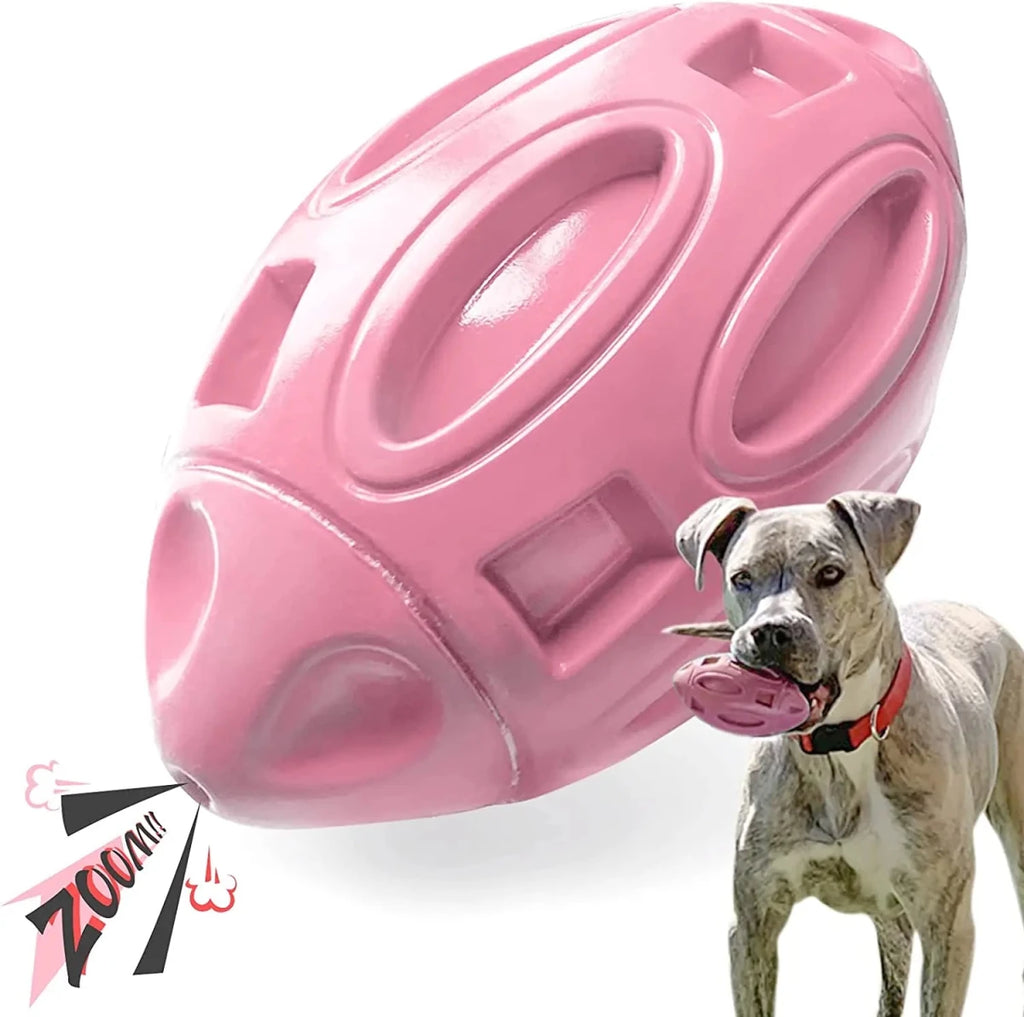 jouet pour chien en forme de balle de rugby de couleur rose. Image produit Boutiquechien 