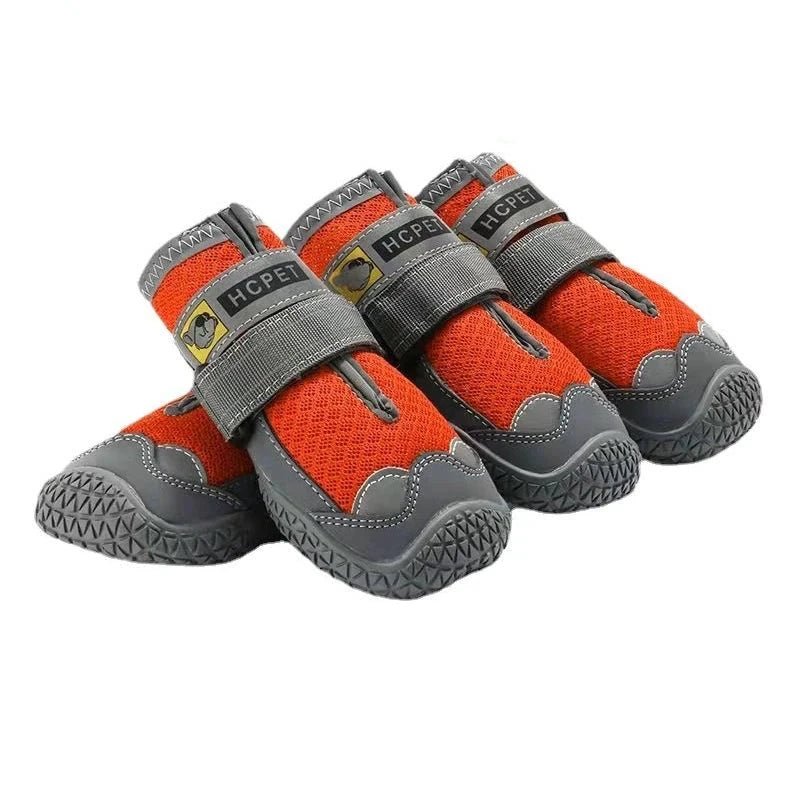 Bottes chaussures pour chien de couleur  grise et orange en lot de 4. Image produit Boutiquechien 