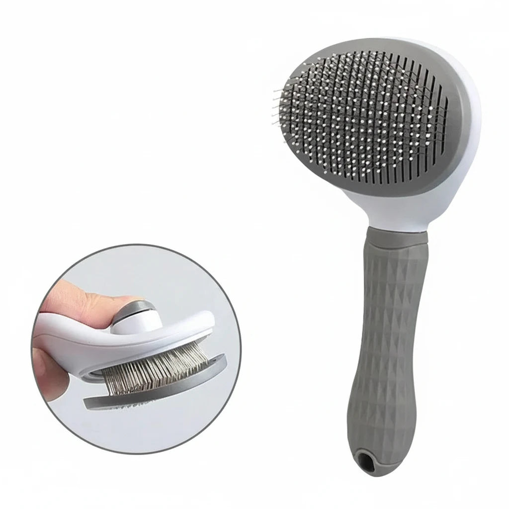 Brosse pour chien de couleur gris et blanc avec un poussoir poil de boutiquechien