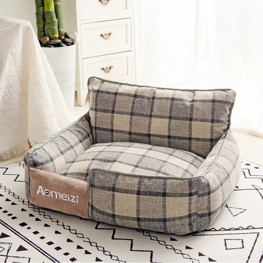 Canapé pour chien de couleur gris à carreaux avec un fond blanc. Image produit Boutiquechien