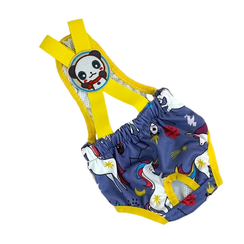 Couche à bretelle pour chien de couleur bleu avec des formes de licorne. Le produit est posé dans un fond blanc. Image produit Boutiquechien
