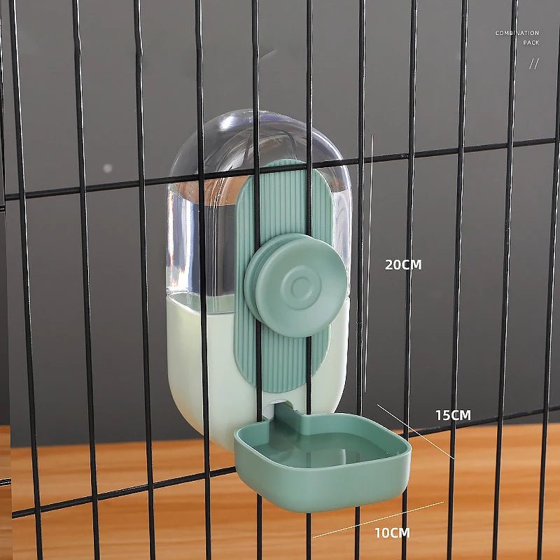 Gamelle d'eau de couleur verte avec toutes les dimensions sur un grillage noir. Image produit Boutiquechien