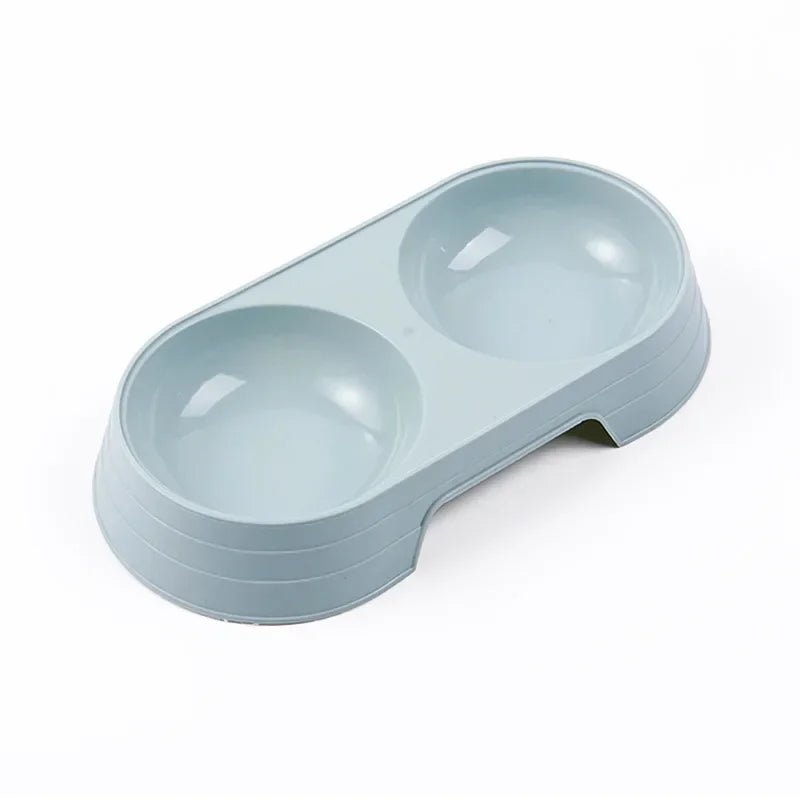 Gamelle en plastique pour chiot de couleur bleu. Petit gamelle double de couleur bleu pour les chiots. Image produit Boutiquechien
