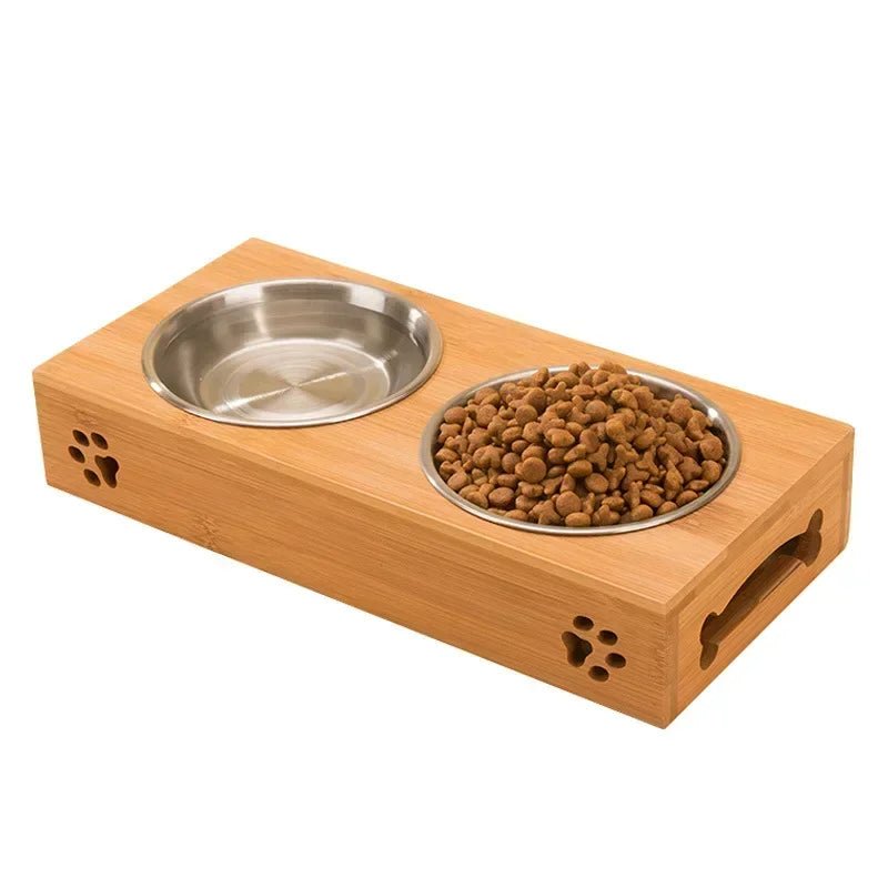 Gamelle double pour chien en inox sur un support bois. Les gamelles double possèdent une gamelle d'eau et de croquette. Image produit Boutiquechien