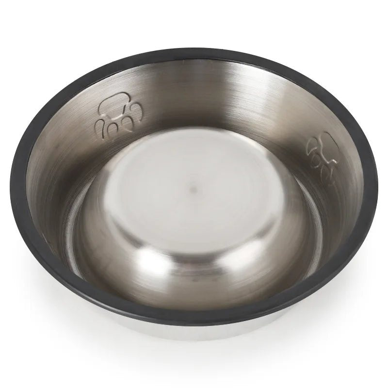 Dos de la gamelle anti-dérapante de couleur noir avec de l'inox. La gamelle à des imprimés pattes dessus. Image produit Boutiquechien