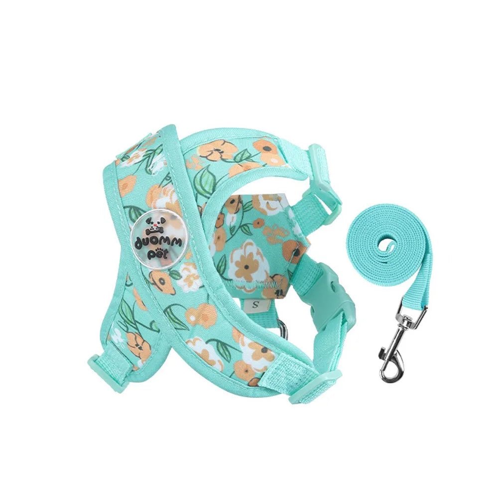 Harnais pour chiot de couleur bleu avec des formes de fleurs rose. Image produit Boutiquechien