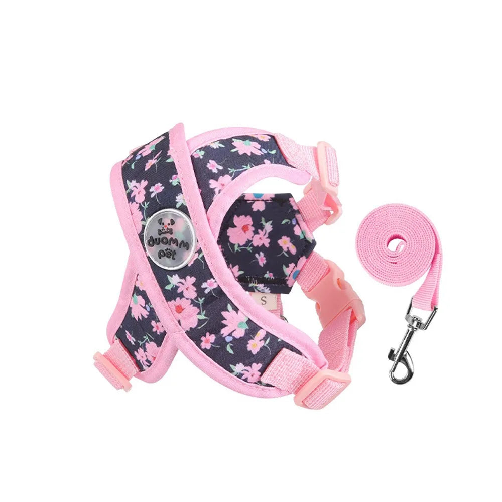 Harnais pour chiot de couleur rose avec des formes de fleurs rose. Image produit Boutiquechien