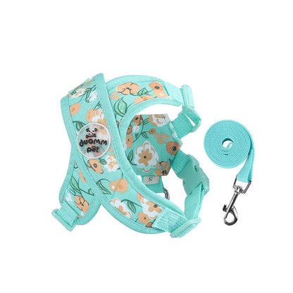 Harnais pour chiot de couleur bleu avec des formes de fleurs rose. Image produit Boutiquechien