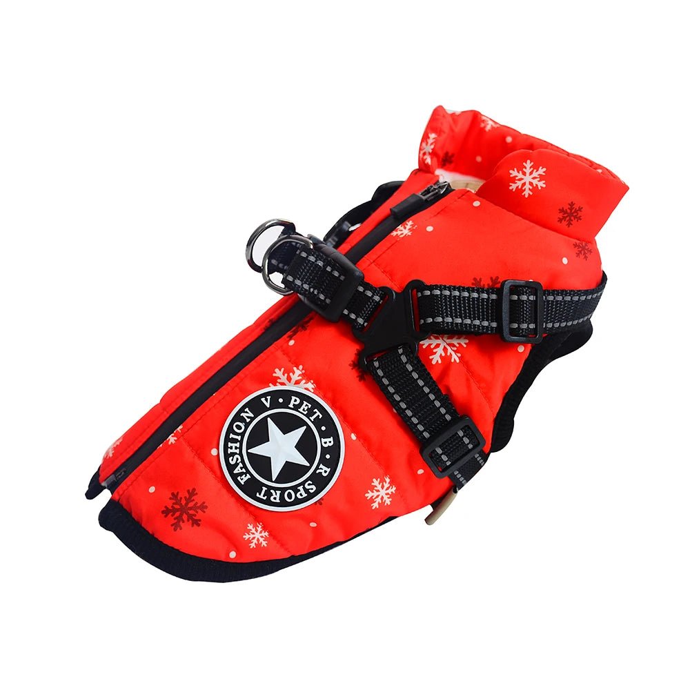 Manteau pour petit chien avec harnais intégré avec des flocons bleu sur un manteau rouge 