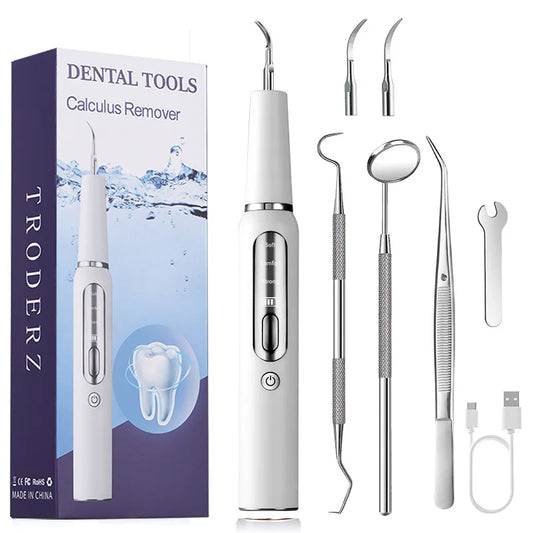 Produit de dentition pour chien anti tartre de couleur blanc avec tous les accessoires accompagnant ce produit 