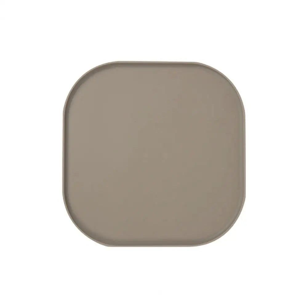 Tapis de protection gamelle de couleur marron  en silicone résistant dans un fond blanc. Image produit Boutiquechien