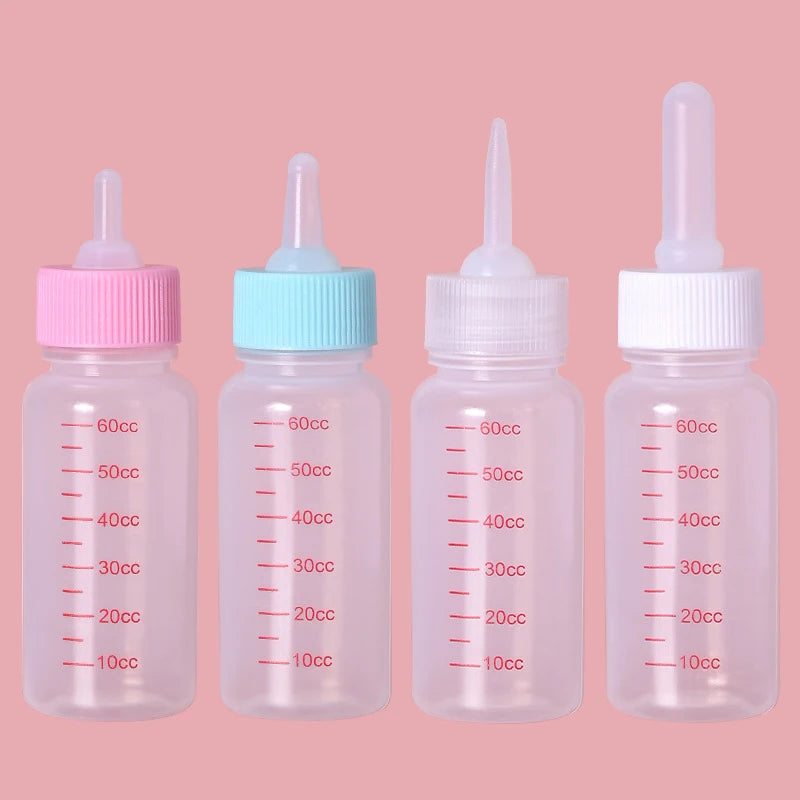 Tous les biberon pour chien de couleur rose, blanc et blanc avec différents embout. Image produit Boutiquechien 